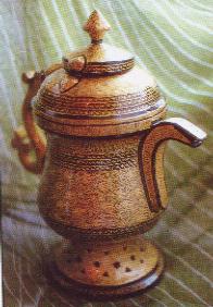 A papier mache replica of a samovar.